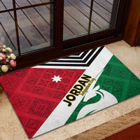 Rubber doormat with Jordan text, star, and red-green folk triangle flag pattern.