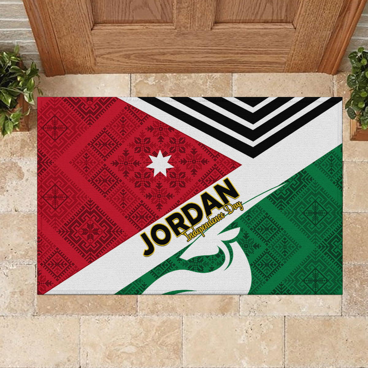 Rectangular rubber doormat with Jordan Independence Day text, red-green triangles, and star.
