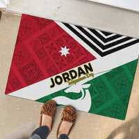 Rubber doormat with red/green folk triangles, white border, black stripes, and 'Jordan' title.
