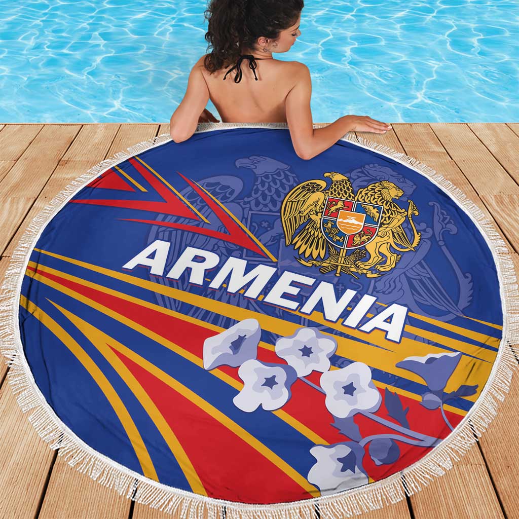 Round blue Armenia beach blanket with fringe edge, spread on wooden deck