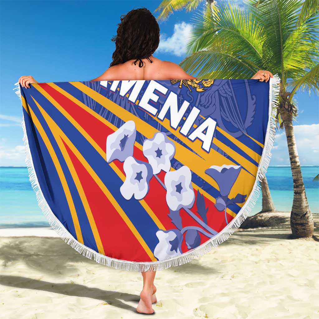 Round blue Armenia beach blanket with fringe edge, held up with Armenia graphic
