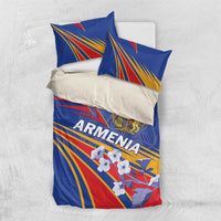 Blue bedding set with two pillows; Armenia crest, fan rays, and flag-style red, white, yellow