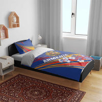 Blue Armenia bedding set with duvet and pillow; crest and ray-striped design on bed
