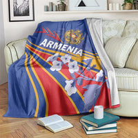Blue blanket draped over sofa, featuring Armenia eagle crest, rays, and red shield