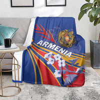 Blue blanket draped over chair, showing “Armenia” text, eagle crest, and flag rays