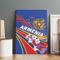 Blue canvas wall art with Armenia lettering, gold crest, and white cloud-like starburst shapes.