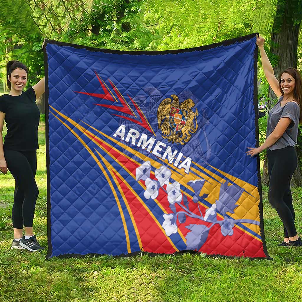 Blue quilted Armenia flag blanket spread on grass with Armenia crest