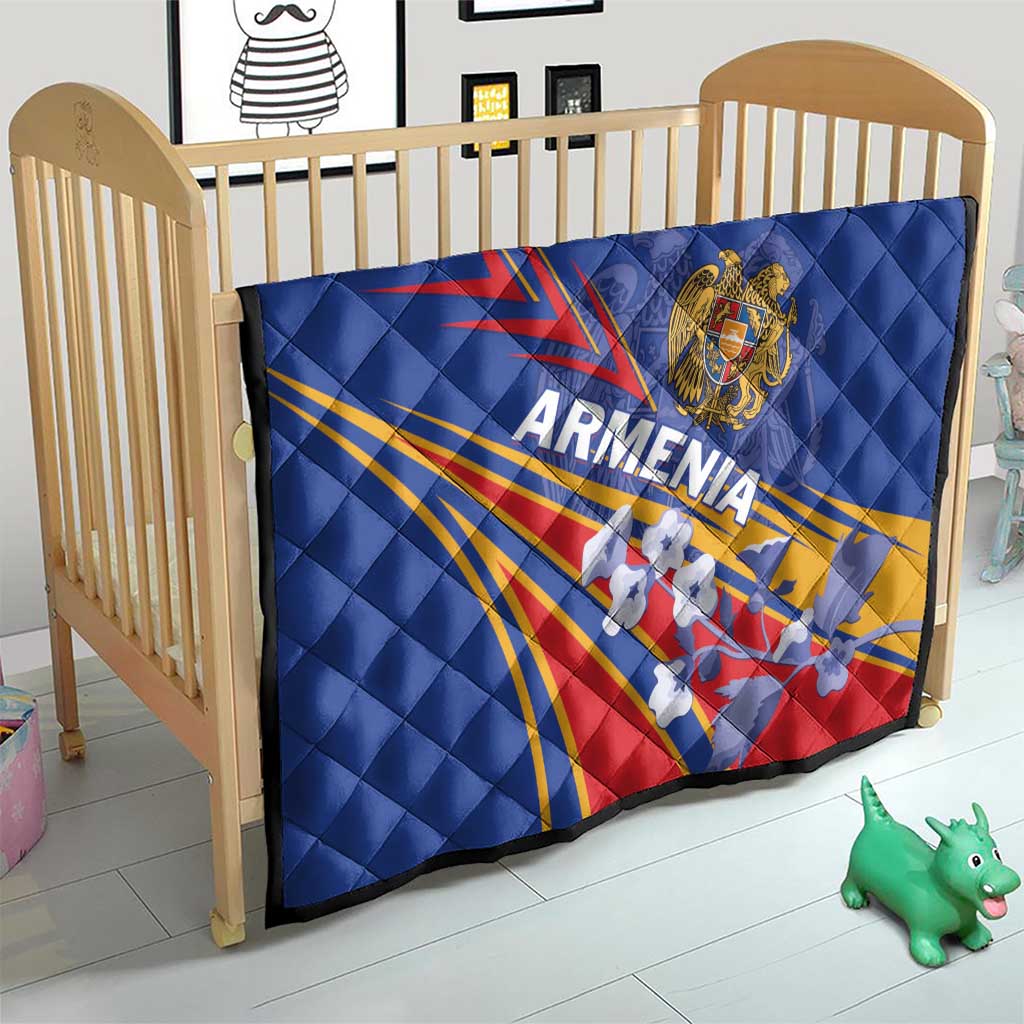 Blue quilted Armenia flag blanket on a wooden baby bed