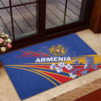 Blue rubber doormat with Armenia crest, multicolor rays, and flower pattern