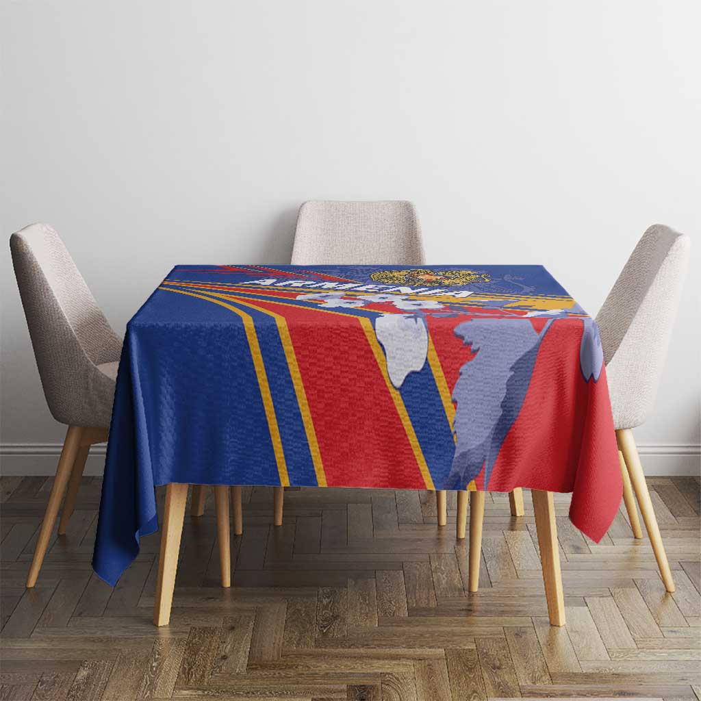 Blue rectangular tablecloth with red and yellow border stripes and illustrated crest figures.