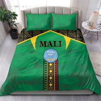 Green bedding set with central Mali crest, geometric print borders, and two green pillows