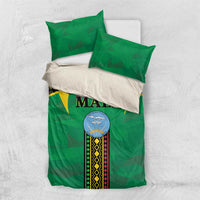 Green bedding set with Mali crest and geometric stripe panel, plus two green pillowcases