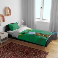Green bedding set with Mali emblem strip center, black/gold patterned border, two pillows
