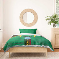 Green bedding set with Mali logo on top panel and two green pillowcases