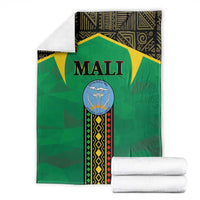 Green Mali-themed blanket folded with 'MALI' crest; included white rolled towels