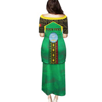 Green long dress, back view, black-yellow patterned yoke and long skirt