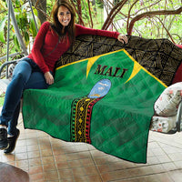 Mali green quilt with black patterned border, yellow star panel, and Mali emblem