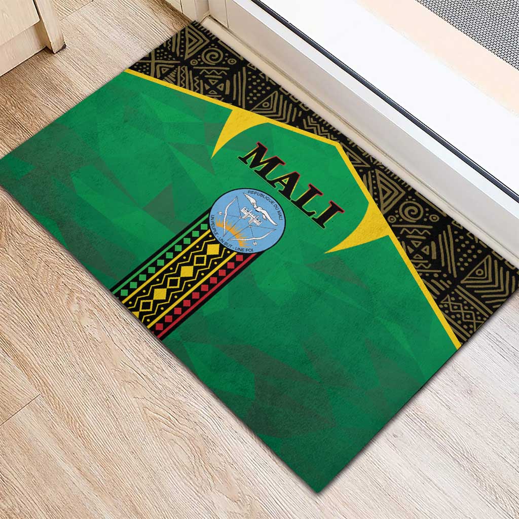 Rectangular green Mali rubber doormat with centered circular emblem and black geometric border