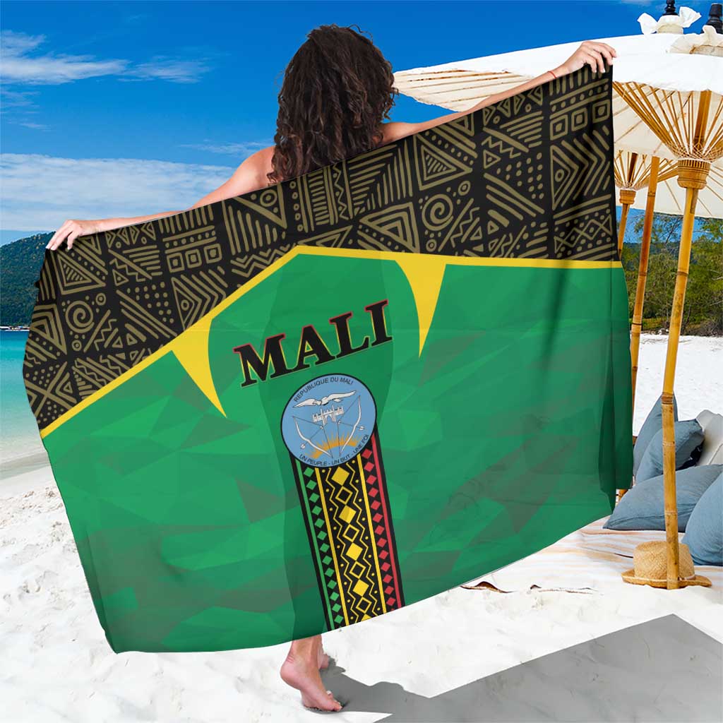Green Mali sarong with printed emblem and geometric border, draped wrap-style