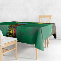 Green Mali tablecloth draped over a table with hanging corner