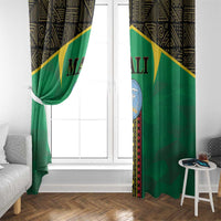Green window curtain with gold diagonal stripe, black top pattern, and Mali crest on panel.
