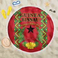 Round red beach blanket with fringed edge, Guinea-Bissau independence graphic center