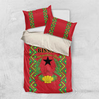 Red duvet cover with green patterned border, black star, and laurel wreath emblem