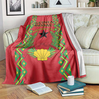 Red blanket with Guinea-Bissau Independence Day design, black star and green-yellow border