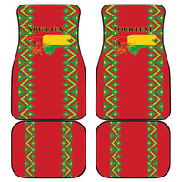 Four red car floor mats with green and yellow diamond geometric border pattern