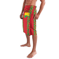Red patterned wrap skirt with green geometric trim and draped side overlap