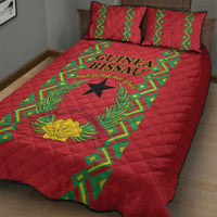 Red quilt bed set with green geometric band, black star, and yellow flower motif