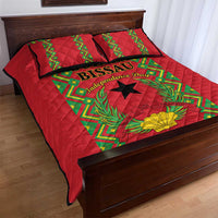 Red quilt bed set with green geometric trim and black star; two matching pillows