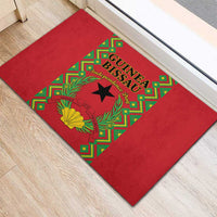 Red entrance doormat featuring Guinea-Bissau Independence Day graphic in green and gold
