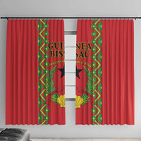 Red window curtain pair with green-and-gold patterned side panels and central divider