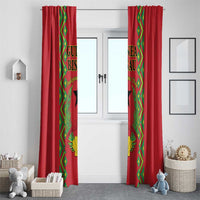 Red window curtains with green-and-gold side panels and hanging header pleats