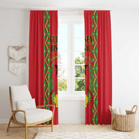 Red window curtains with green-and-gold patterned center panels and full-length drop