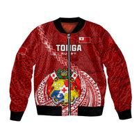 Red patterned bomber jacket with zip front, ribbed cuffs and large crest graphic