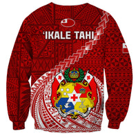 Red rugby sweatshirt with back tribal pattern, 'IKALE TAHI' text, and crest emblem