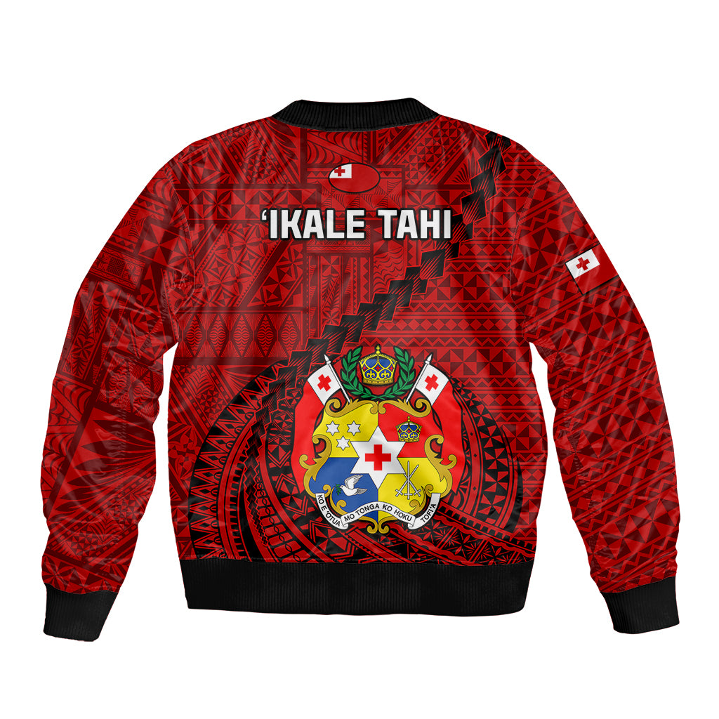 Red bomber jacket with back crest and 'IKALE TAHI' text, black ribbed hem.