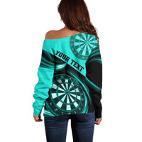Turquoise off-shoulder sweater with "YOUR TEXT" band and dartboard graphic.