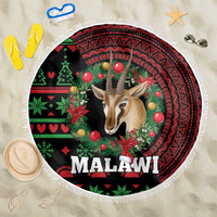 Round Christmas beach blanket with fringe, gazelle head and MALAWI text on dark base