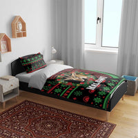 Black Malawi Christmas bedding set on bed with antelope design and green/red holiday motifs