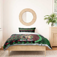 Black Malawi Christmas bedding set on bed with antelope head and green/red striped border