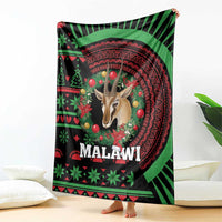 Black Malawi Christmas blanket hanging, gazelle portrait surrounded by ornaments and greenery