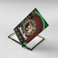 Malawi canvas wall art with gazelle head, red wreath, and Christmas ornaments