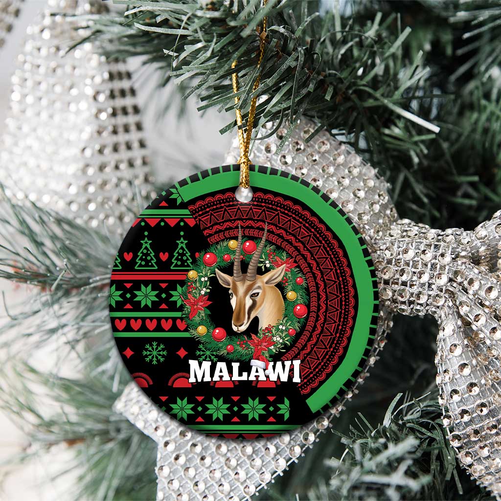 Round ceramic ornament with gazelle head in wreath design, MALAWI text, hanging on pine