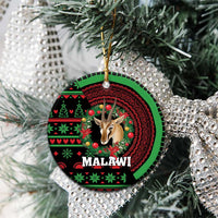 Round ceramic ornament with gazelle head in wreath design, MALAWI text, hanging on pine