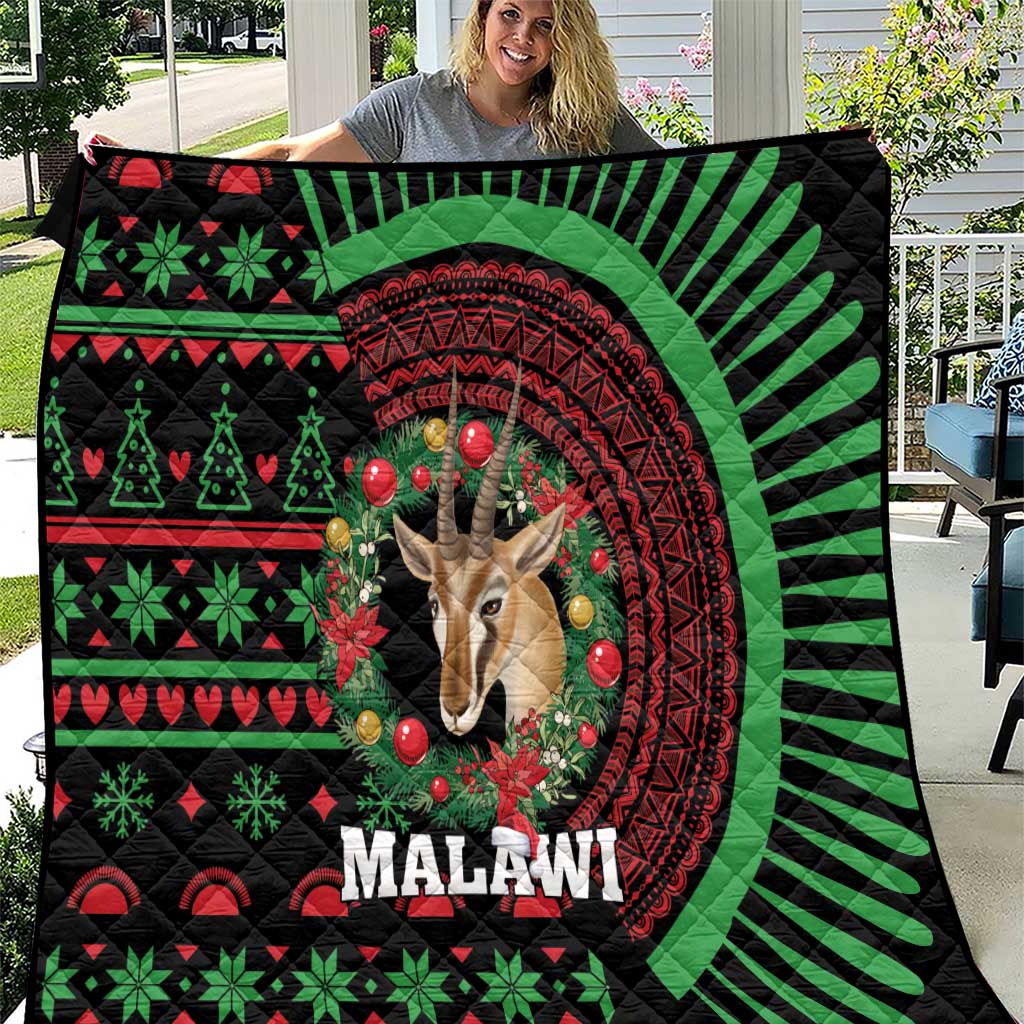 Black Malawi Christmas quilt with green red pattern and giraffe portrait centered