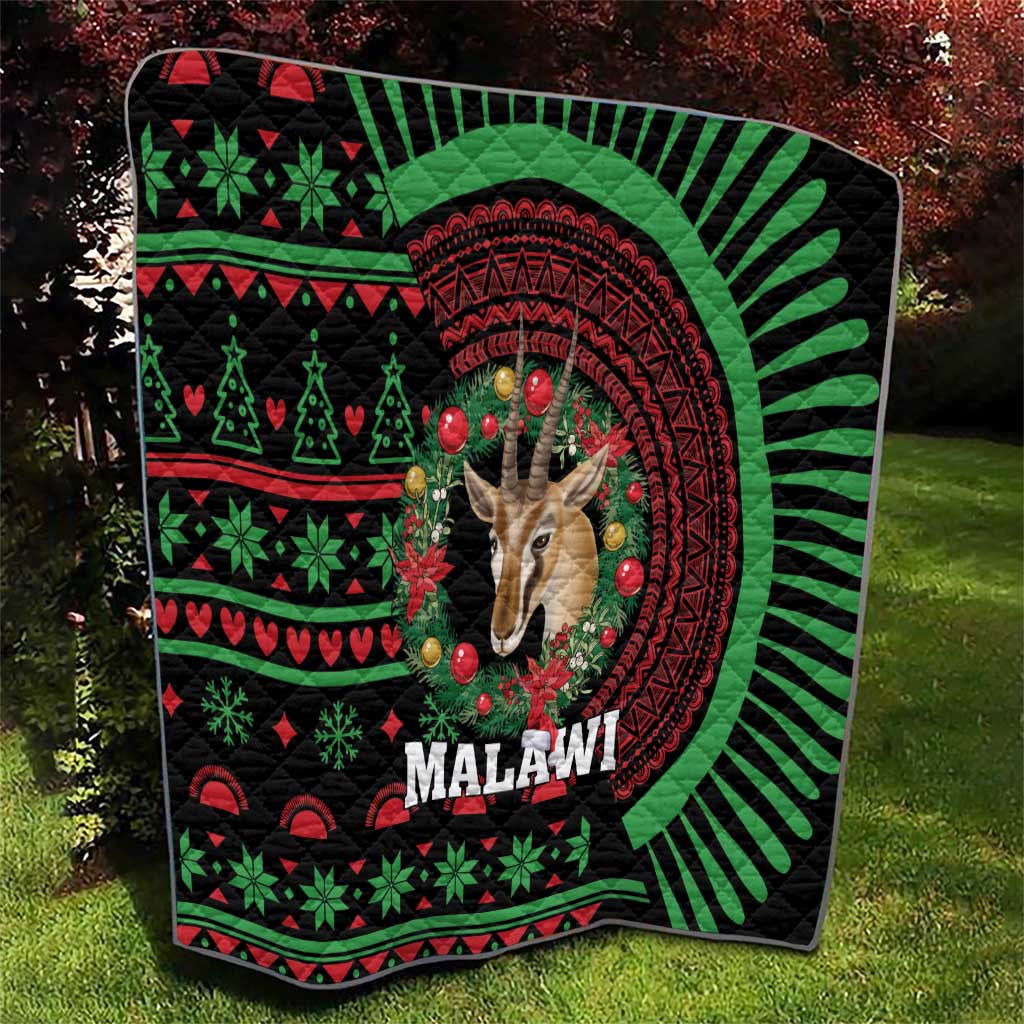 Black Malawi Christmas quilt with giraffe head, red circular design, green holiday motifs