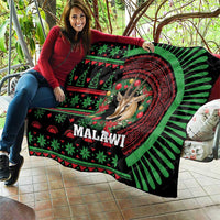 Black Malawi Christmas quilt featuring giraffe face and red mandala surrounded by green stripes